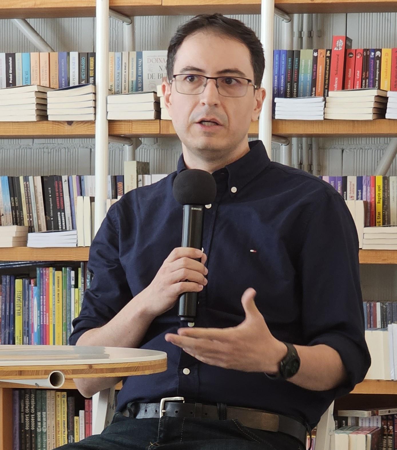 Me (Adrian Manea) talking to the audience at a book launch